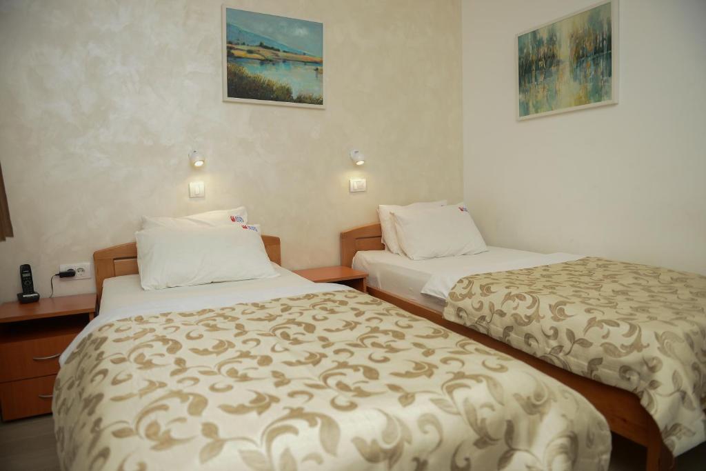 Postel nebo postele na pokoji v ubytování Hotel Sunce