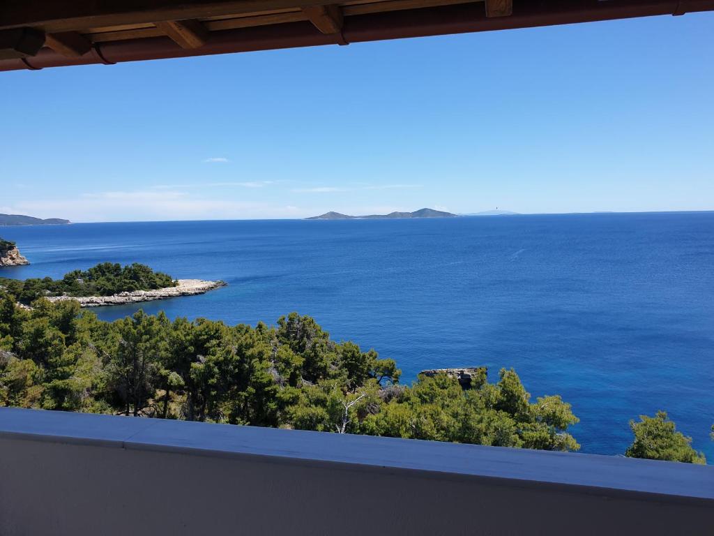 a view of the ocean from a house at Pantheon Attic in Alonnisos Old Town