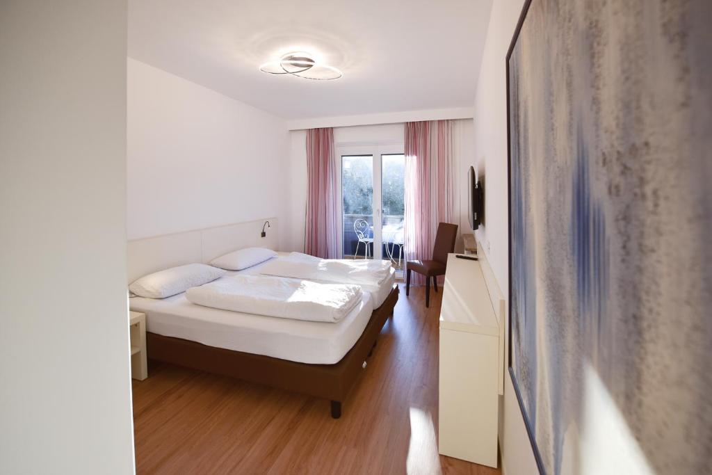 Postel nebo postele na pokoji v ubytování Pension Martha