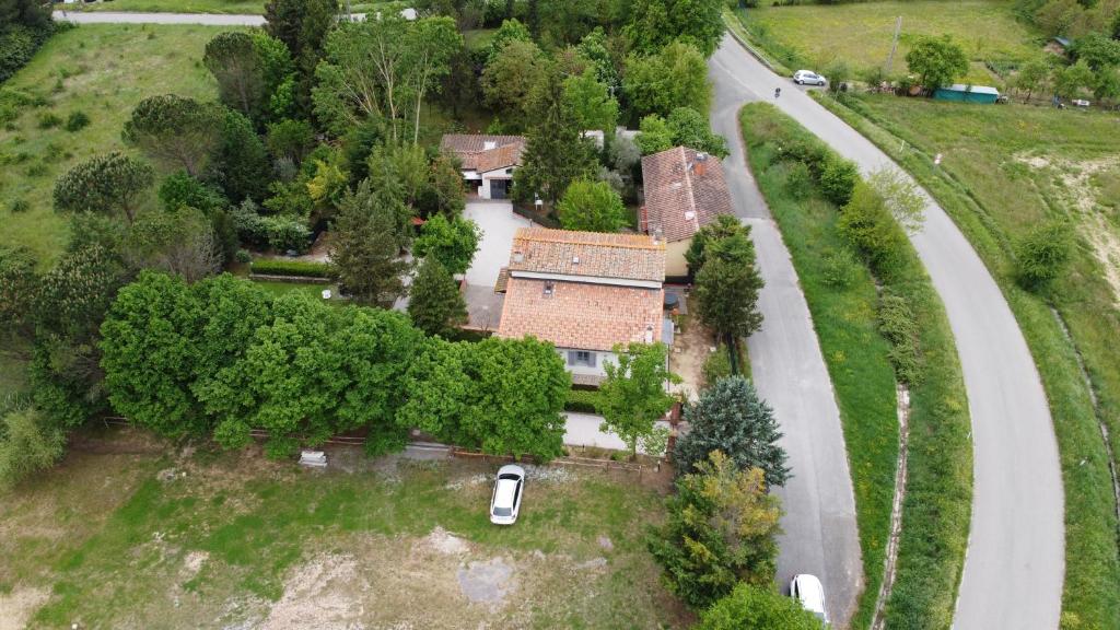 an aerial view of a house and a road at Sant Andrea Country Cottage in Barberino di Mugello