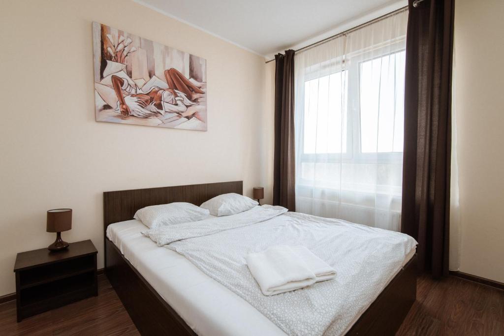 Posteľ alebo postele v izbe v ubytovaní Senator Warsaw Apartments