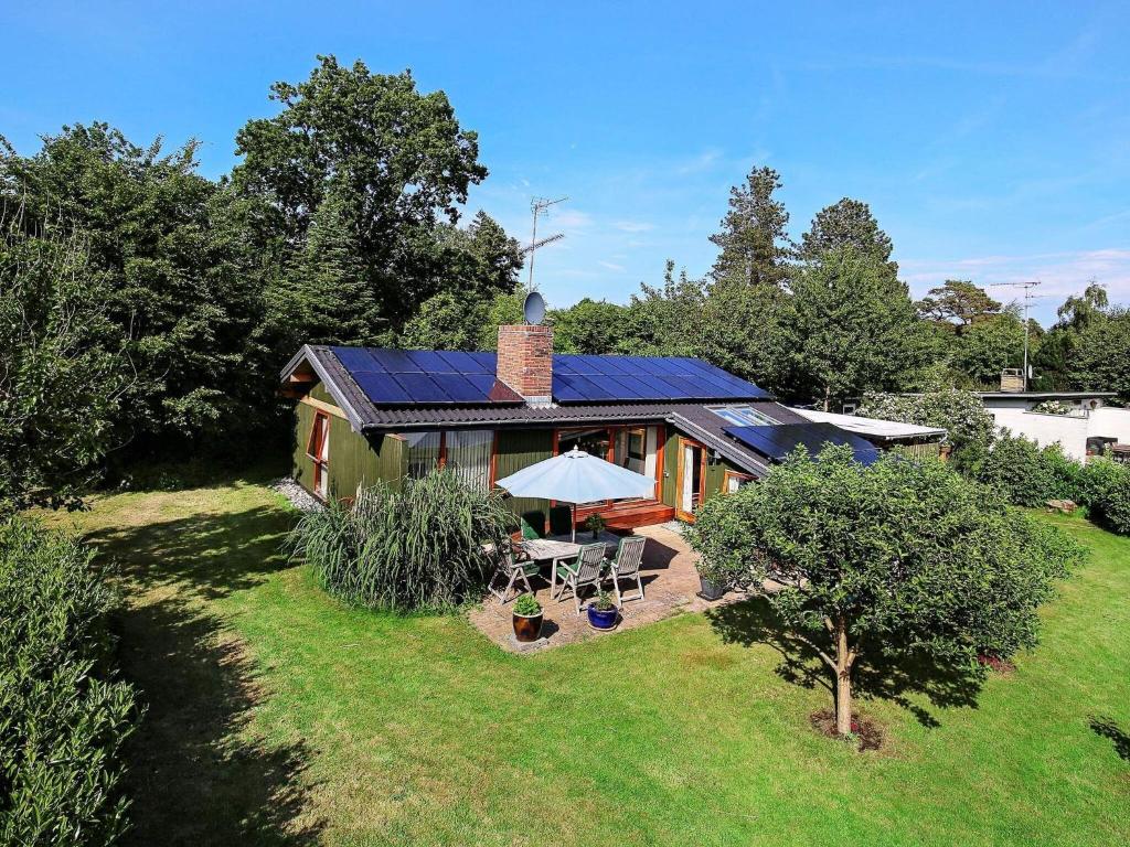 a house with solar panels on top of it at 6 person holiday home in Gilleleje in Gilleleje