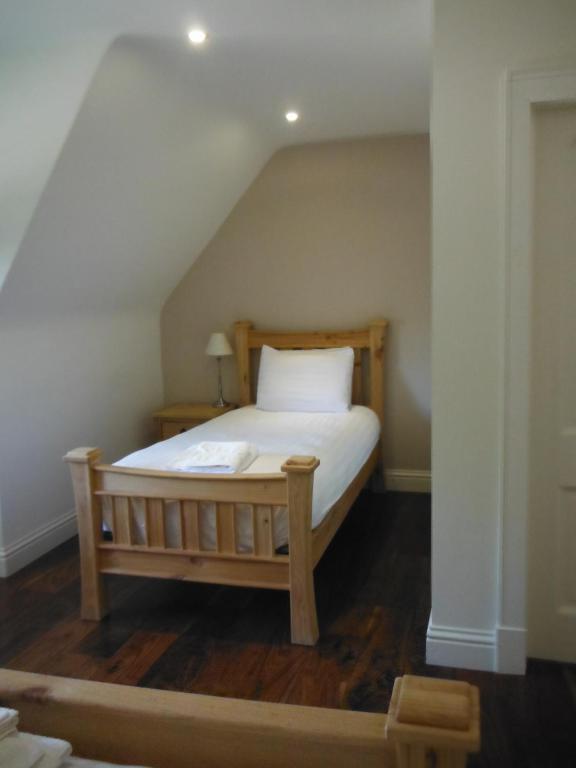 a bedroom with a bed in the attic at Inspiration Lodge in Anascaul