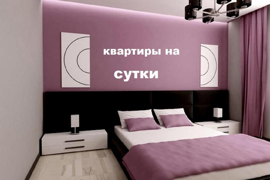 Łóżko lub łóżka w pokoju w obiekcie Евро Люкс с видом на реку