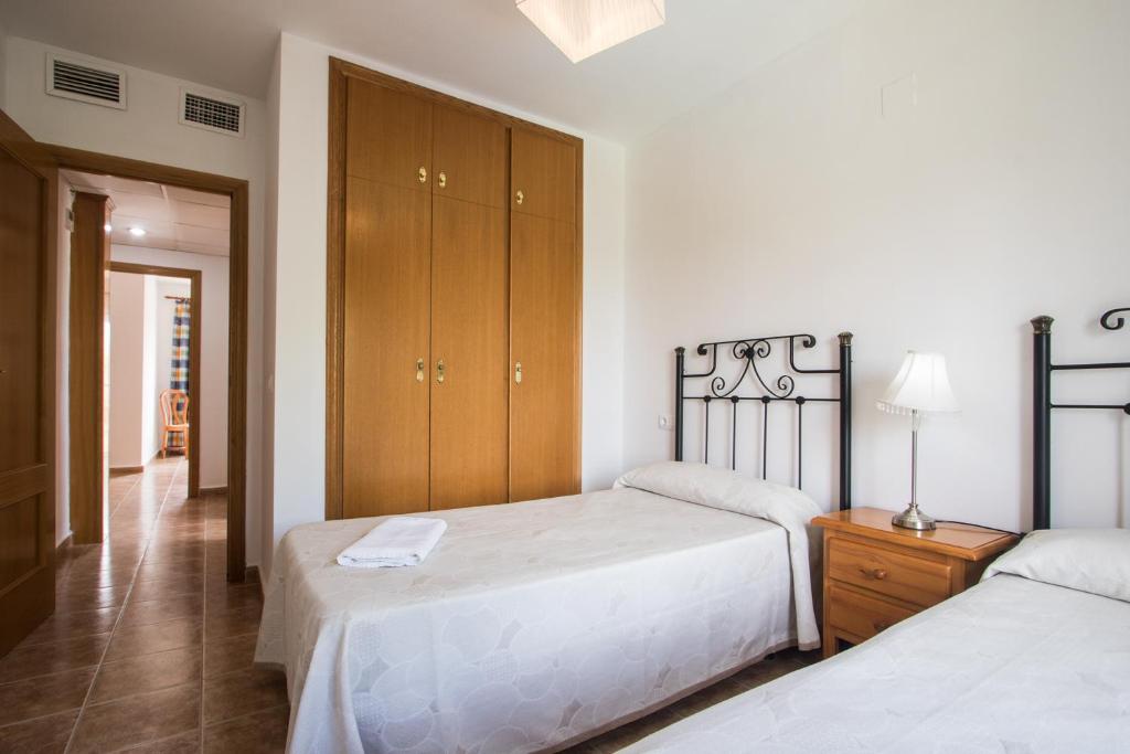 Postel nebo postele na pokoji v ubytování Apartamentos Nicaragua