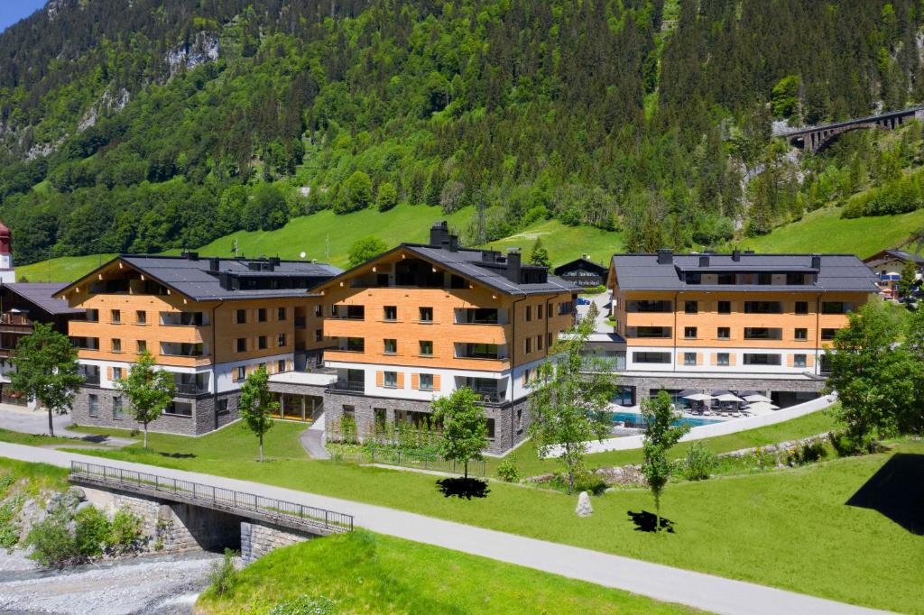 an aerial view of a resort with a bridge at ArlbergResort Klösterle in Klösterle am Arlberg