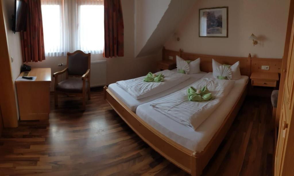 Postel nebo postele na pokoji v ubytování Hotel Igelstadt