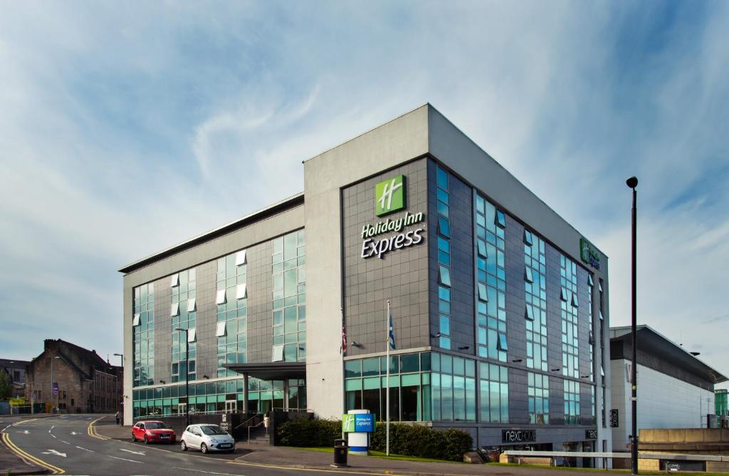 a building with a sign on the side of it at Holiday Inn Express Hamilton, an IHG Hotel in Hamilton