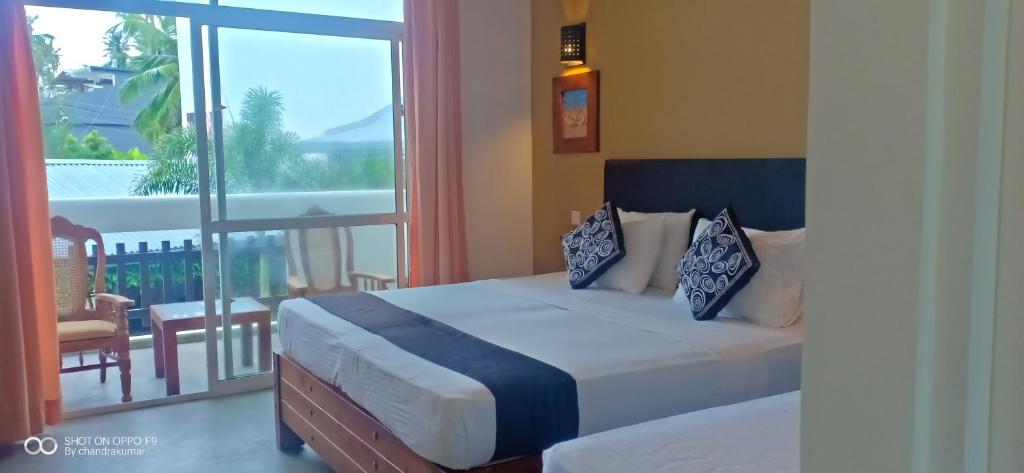 Postel nebo postele na pokoji v ubytování Nil Diya Beach Resort