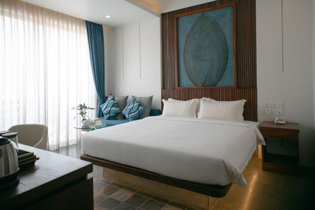 Postel nebo postele na pokoji v ubytování HARI Residence & Spa
