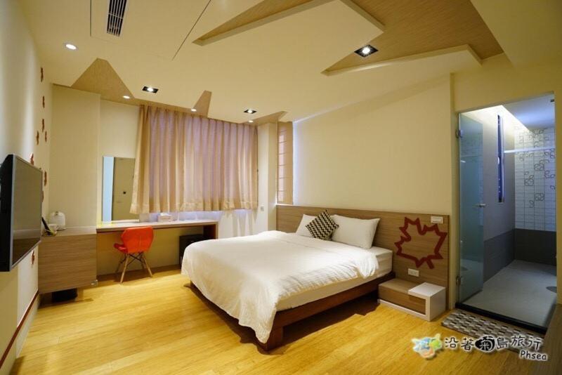 Postel nebo postele na pokoji v ubytování CHEN FENG HOMESTAY
