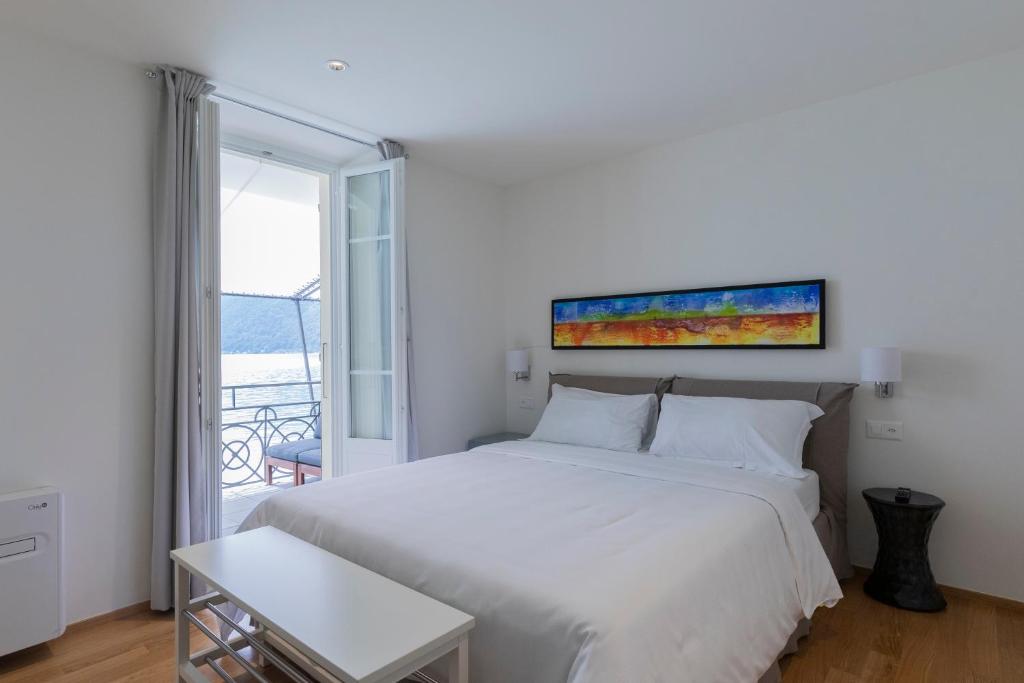 Postel nebo postele na pokoji v ubytování Lac Hotel