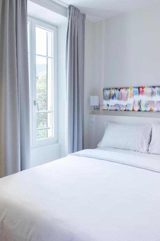 Postel nebo postele na pokoji v ubytování Lac Hotel