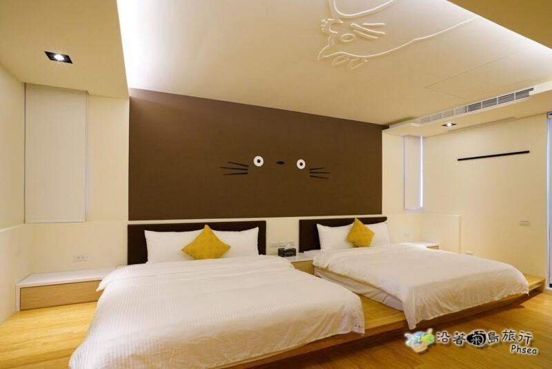 Postel nebo postele na pokoji v ubytování CHEN FENG HOMESTAY