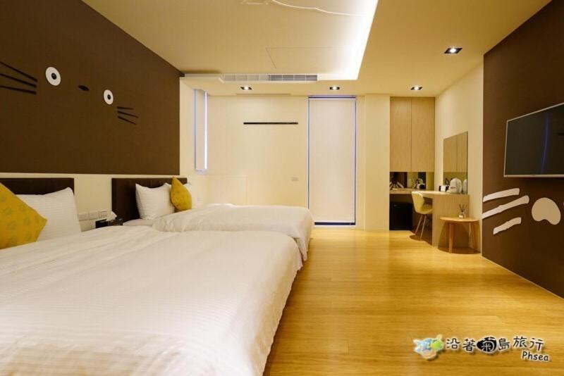 Postel nebo postele na pokoji v ubytování CHEN FENG HOMESTAY