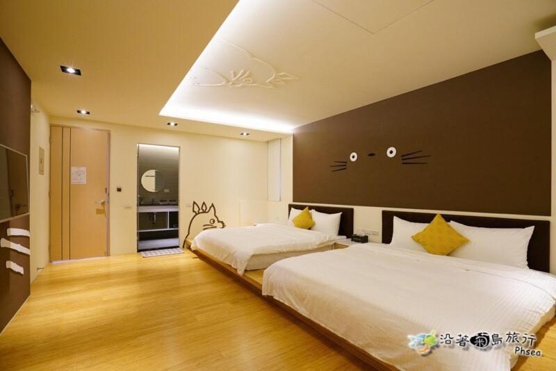 Postel nebo postele na pokoji v ubytování CHEN FENG HOMESTAY