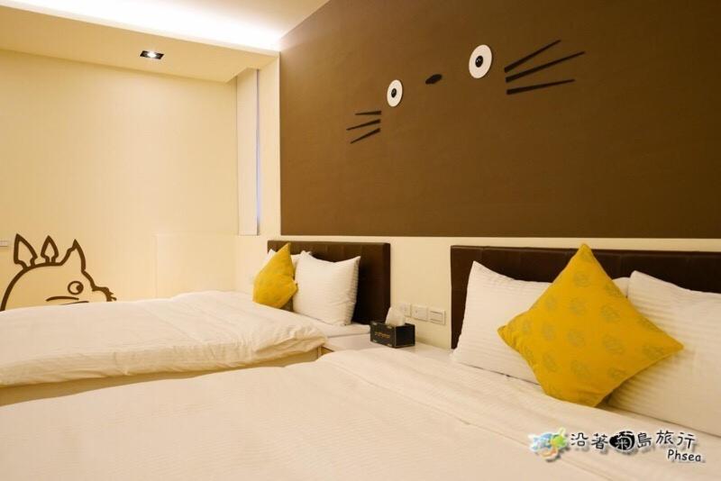 Postel nebo postele na pokoji v ubytování CHEN FENG HOMESTAY