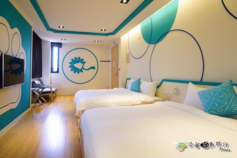 Postel nebo postele na pokoji v ubytování CHEN FENG HOMESTAY
