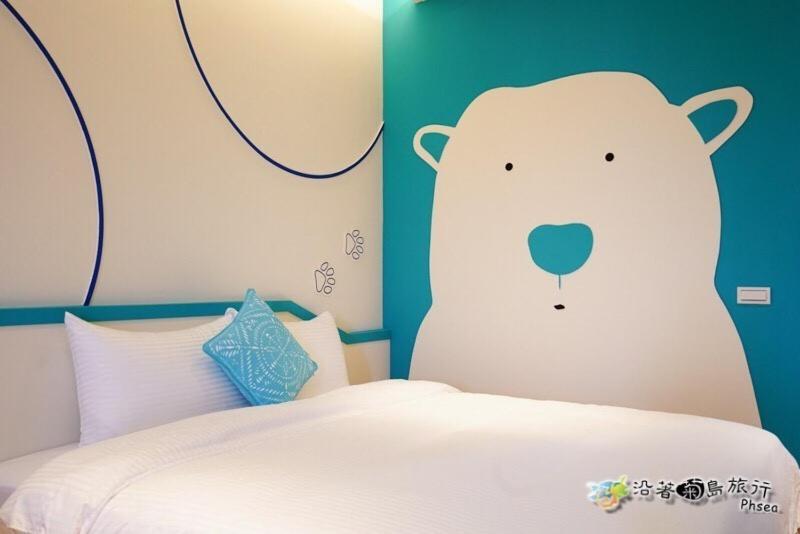 Postel nebo postele na pokoji v ubytování CHEN FENG HOMESTAY