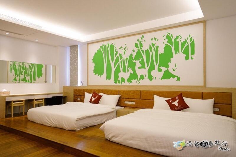 Postel nebo postele na pokoji v ubytování CHEN FENG HOMESTAY