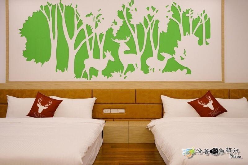 Postel nebo postele na pokoji v ubytování CHEN FENG HOMESTAY