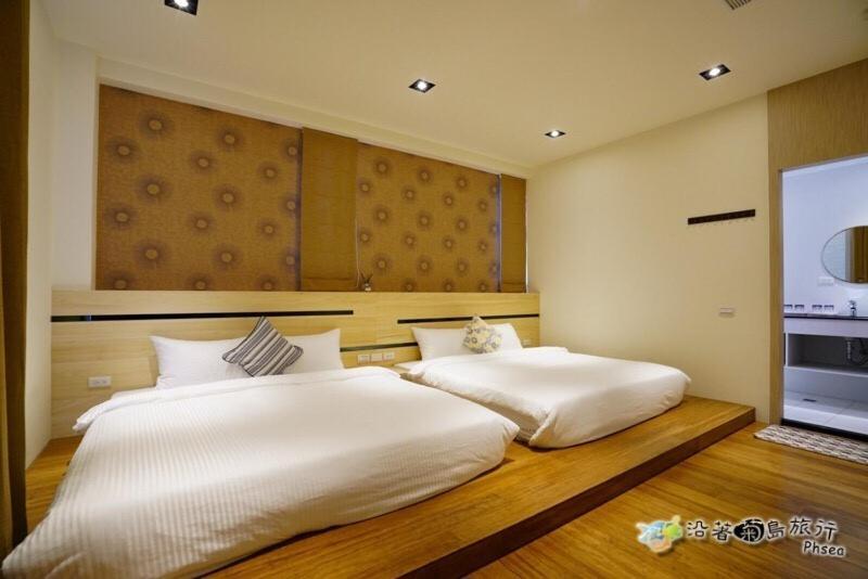 Postel nebo postele na pokoji v ubytování CHEN FENG HOMESTAY