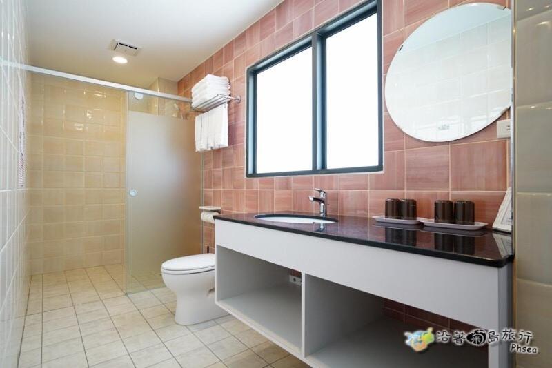 Koupelna v ubytování CHEN FENG HOMESTAY