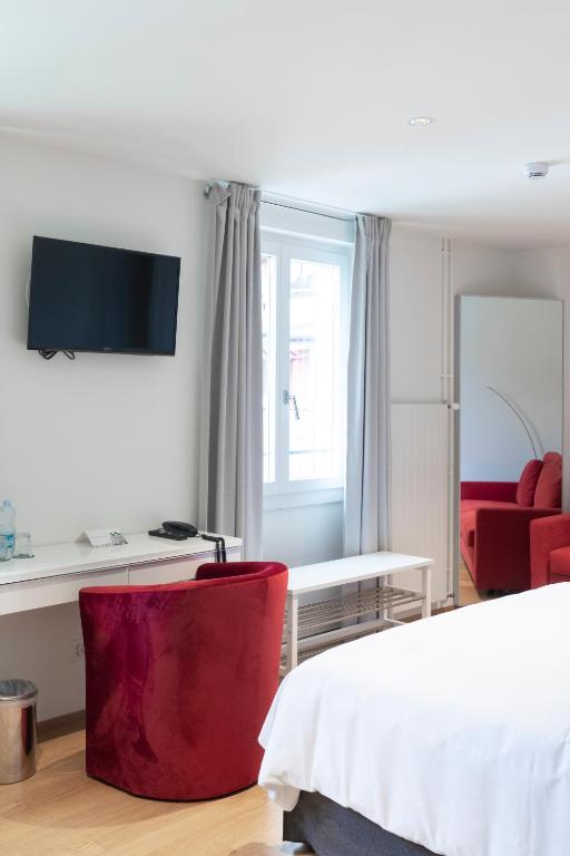 TV a/nebo společenská místnost v ubytování Lac Hotel