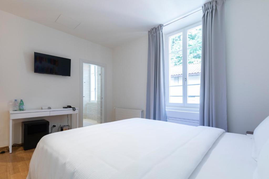 Postel nebo postele na pokoji v ubytování Lac Hotel