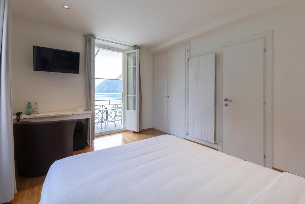 Postel nebo postele na pokoji v ubytování Lac Hotel