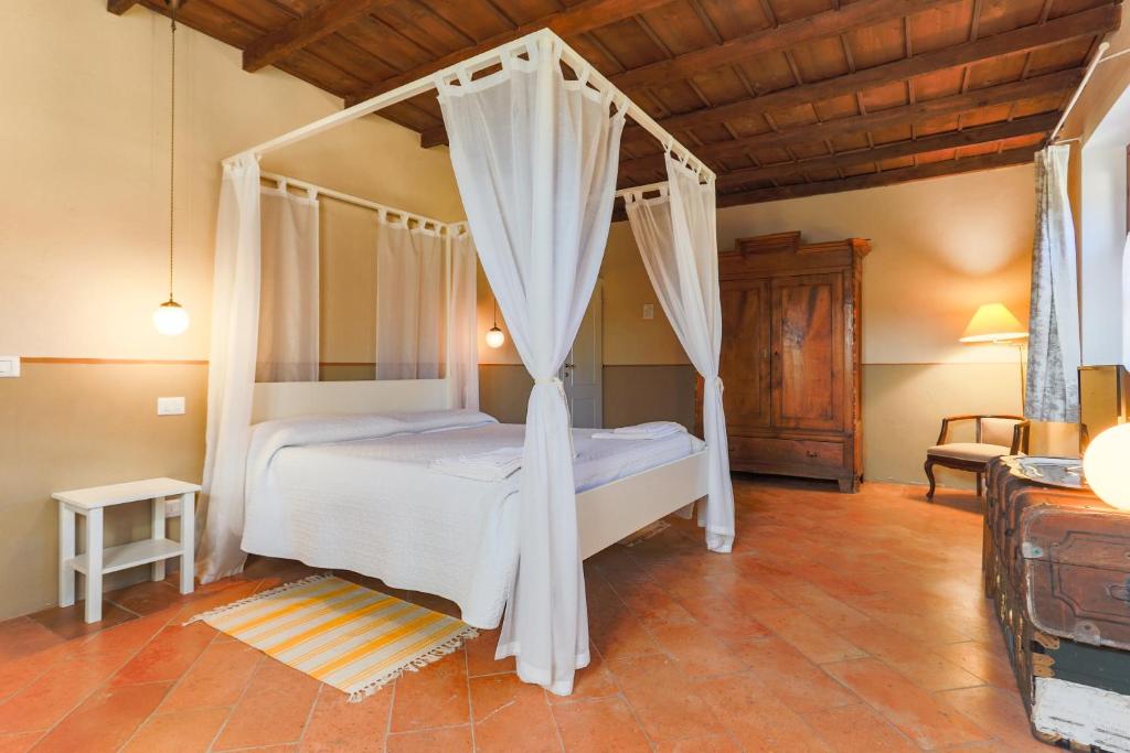 Postel nebo postele na pokoji v ubytování AGRITURISMO LE CORTI DELLA GUALDANA