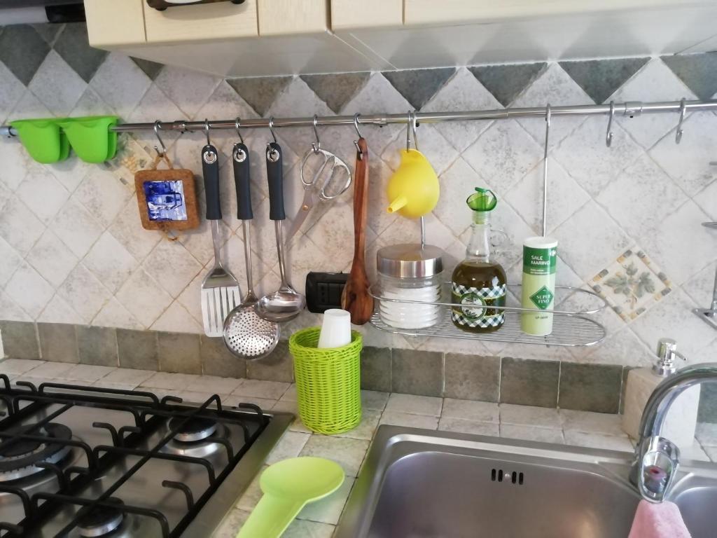 a kitchen counter with a sink and a stove at Casa Francesca in Milan