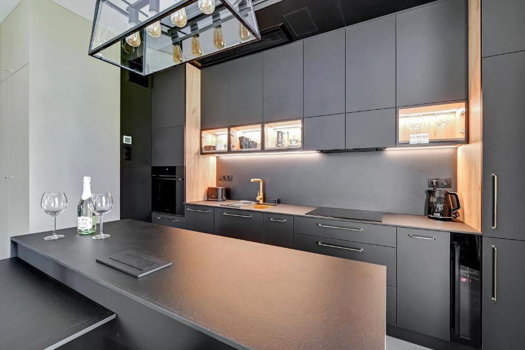 Kuchyňa alebo kuchynka v ubytovaní Botanica Premium Apartments