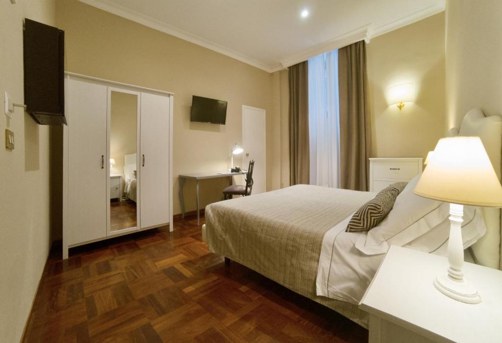 Postel nebo postele na pokoji v ubytování Hotel Touring Wellness & Beauty