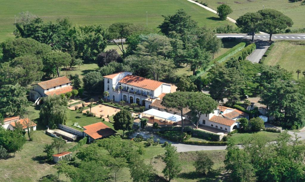 an aerial view of a large house with trees at Antico Borgo di Sutri in Sutri