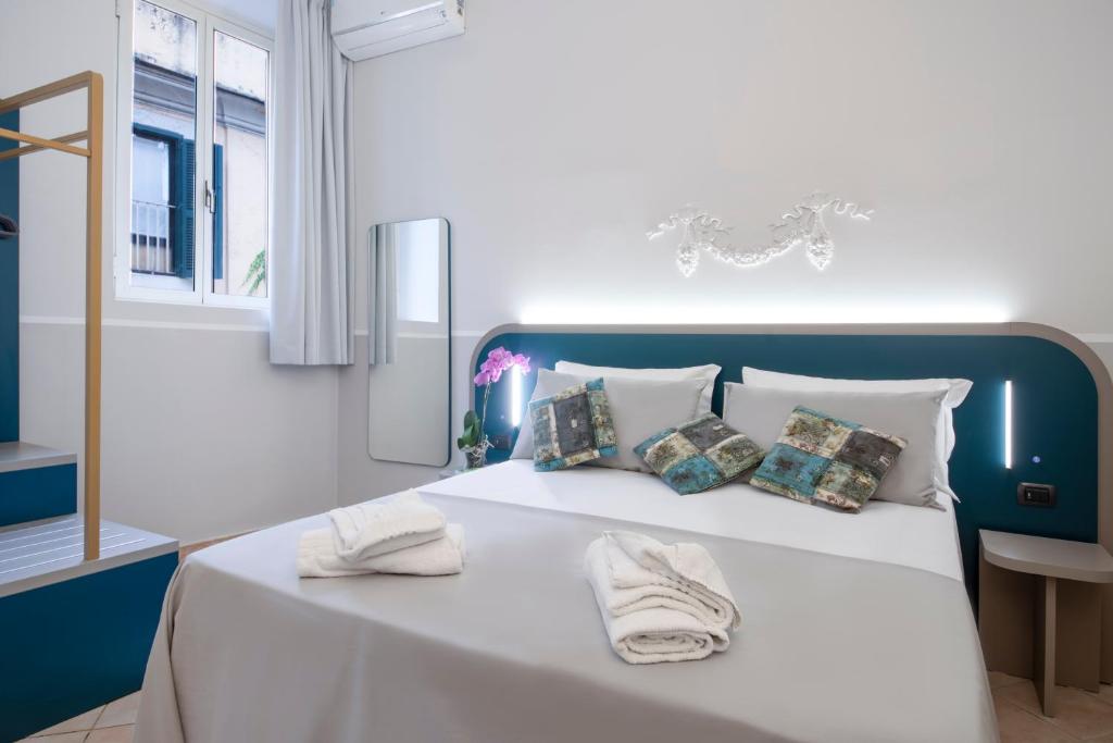 מיטה או מיטות בחדר ב-Hotel Grifo