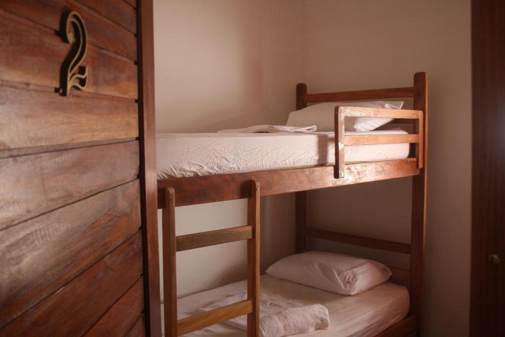 Cama ou camas em um quarto em Villa Chic Hostel Pousada
