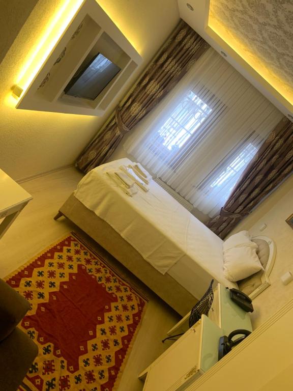 Postel nebo postele na pokoji v ubytování elisa hotel