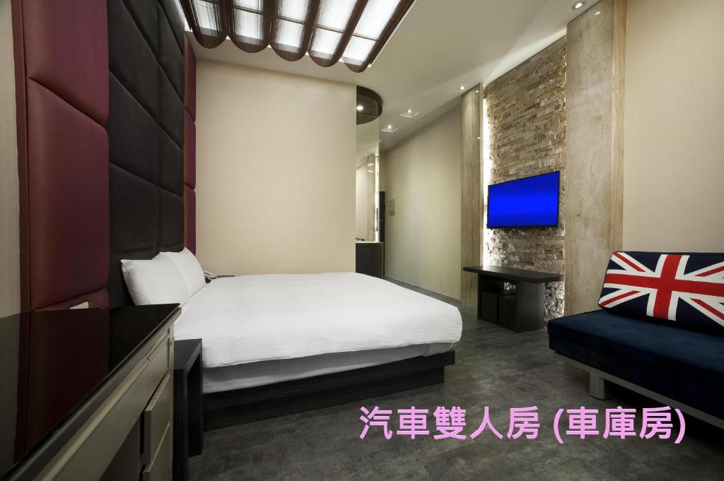 Postel nebo postele na pokoji v ubytování Two Fukun Hotel