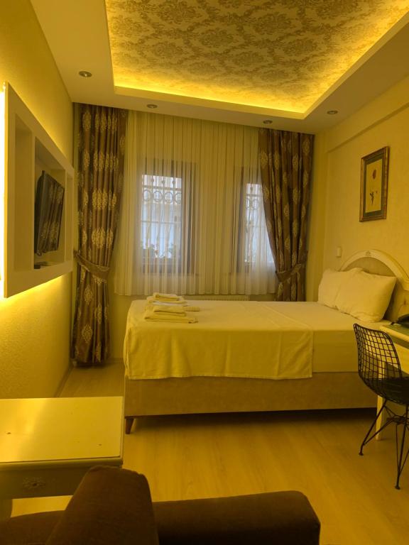 Postel nebo postele na pokoji v ubytování elisa hotel