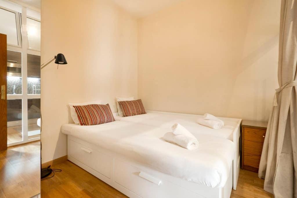 Postel nebo postele na pokoji v ubytování Apartment Poble Nou