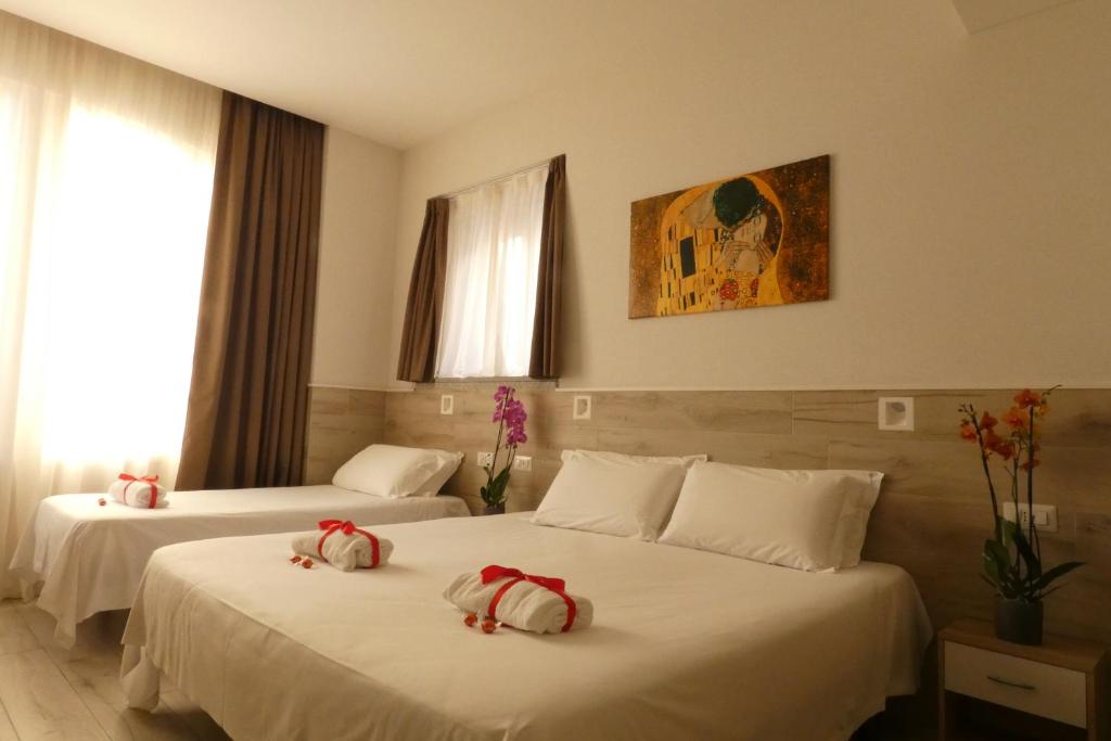 Łóżko lub łóżka w pokoju w obiekcie Eurohotel