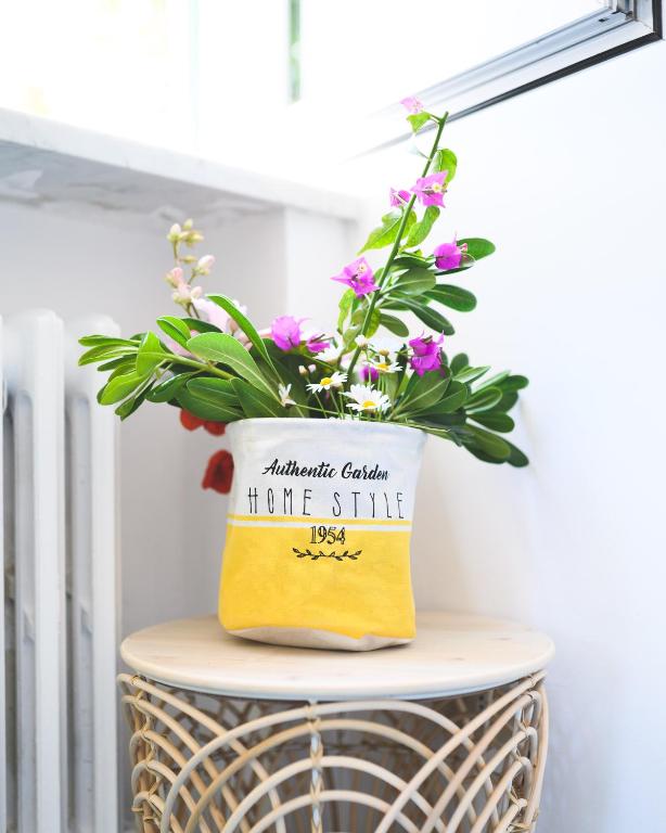 a pot of flowers sitting on top of a table at Parco Augusto in Capri