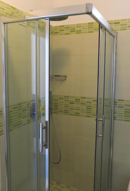a shower with a glass door in a bathroom at Parco Augusto in Capri