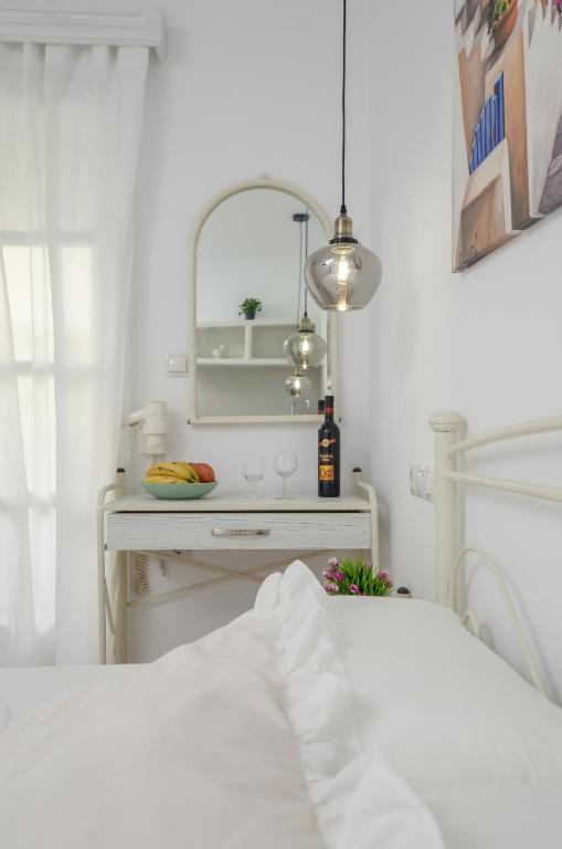 Postel nebo postele na pokoji v ubytování simos luxury apartments