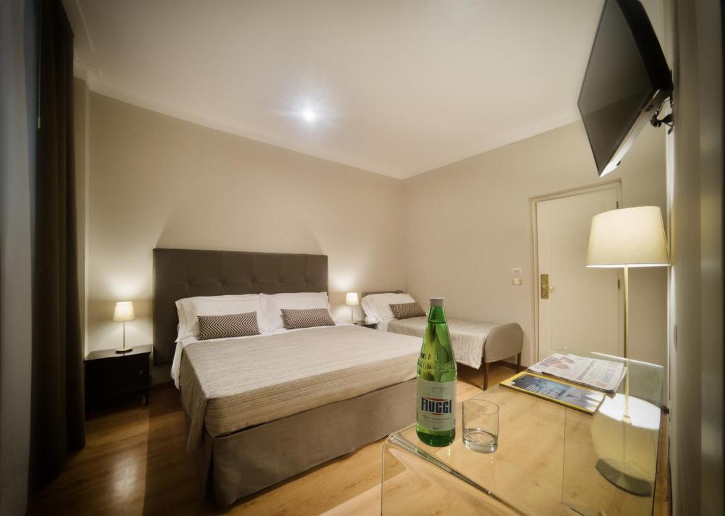Postel nebo postele na pokoji v ubytování Hotel Touring Wellness & Beauty