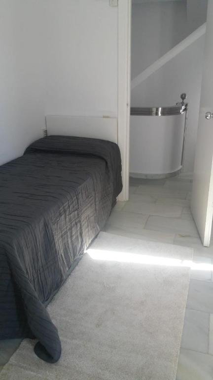 Postel nebo postele na pokoji v ubytování Marbella House Penthouse