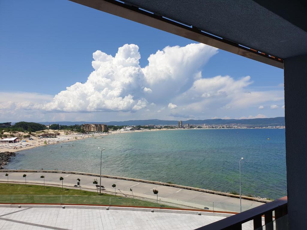 a view of a beach from a balcony at PARADISO 311 Private Studio Nesebar in Nesebar