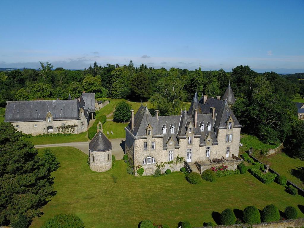 an aerial view of a large house on a green field at La Sicorie in Saint-Germain-le-Guillaume