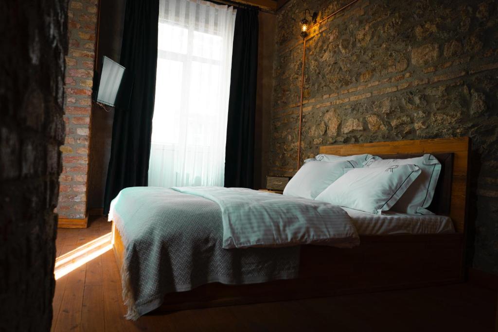Postel nebo postele na pokoji v ubytování Reu de Hotel